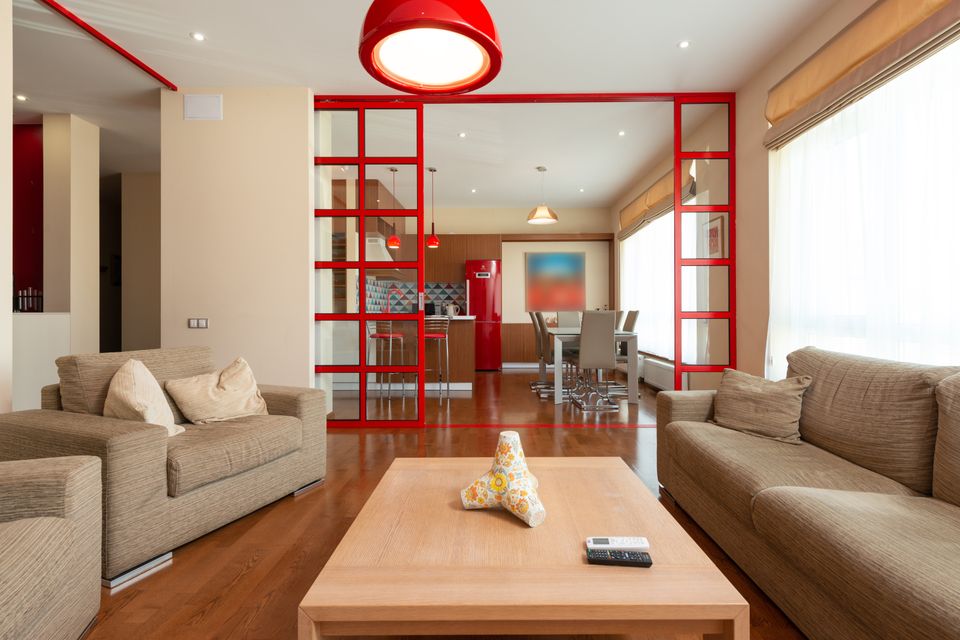 Contemporary living space with red accents